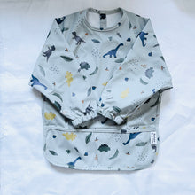 Load image into Gallery viewer, BRAELON BIB/ SMOCK (DINOSAUR BLUE)
